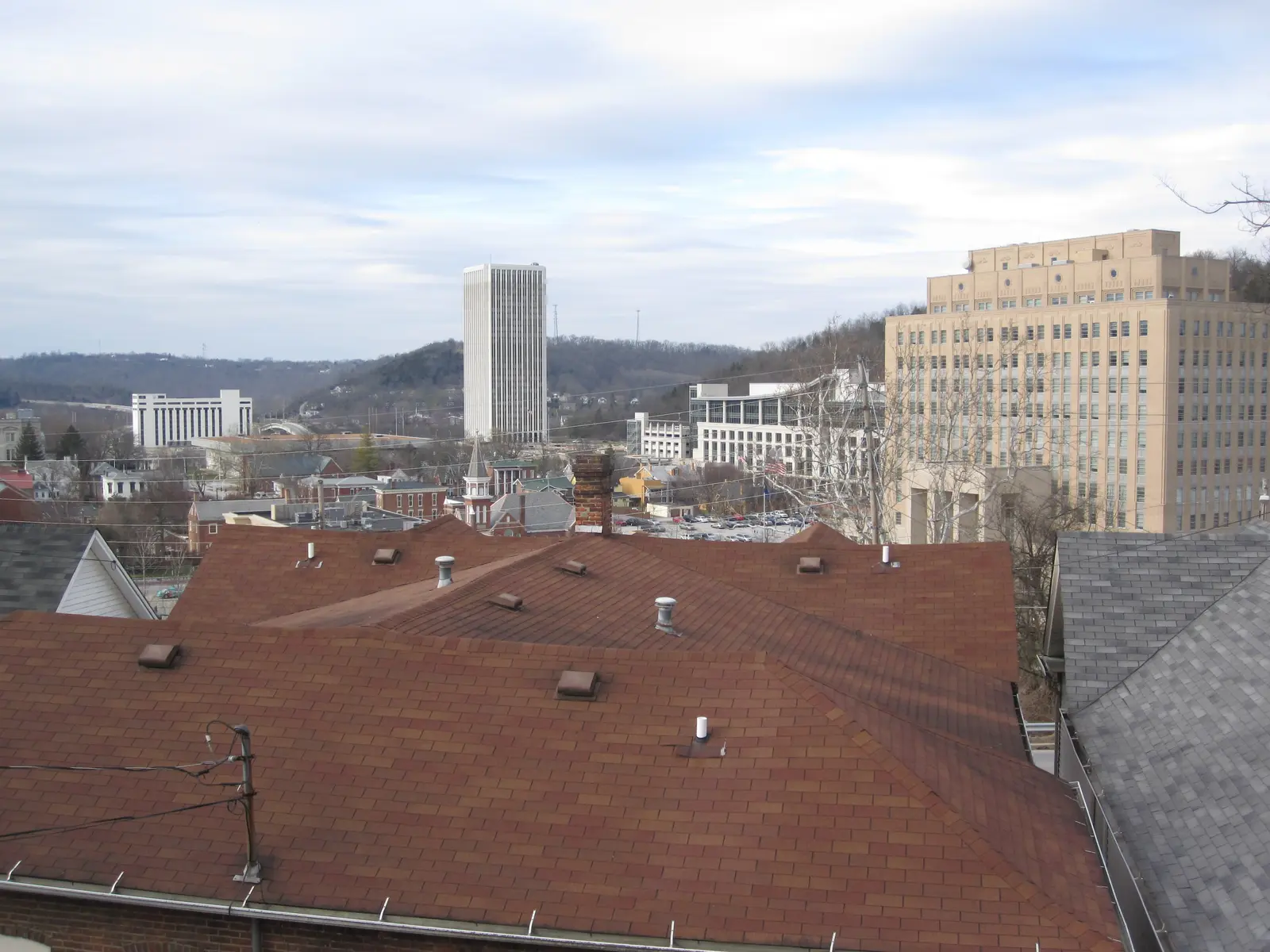 Rooftops of downtown Frankfort with the state office buildings beyond